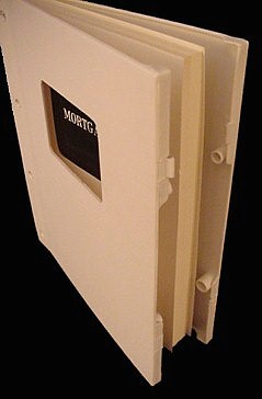 Compact book molded poly covers snap securely